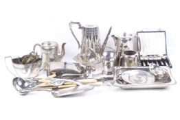 A collection of silver plated items and flatware.