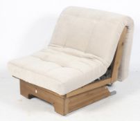 A contemporary Devonshire 'futon' style chair bed.