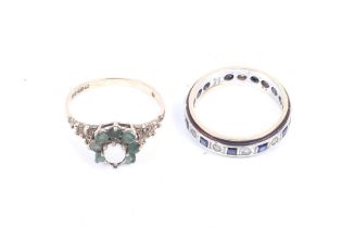 Two 9ct gold and gem set rings. Comprising a small white opal and emerald cluster ring. Size M, 1.