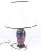 A Moorcroft table lamp and shade.