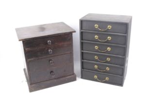 Two table top miniature chests of drawers.