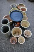 A collection of twenty assorted garden plant pots.