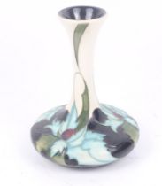 A Moorcroft Sea Holly vase. Designed by Emma Bossons, dated 2006. H16cm. (AF).