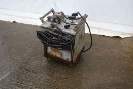 A Cytringan electric arc welder. Oil cooled with lance and is on wheels, H61cm.