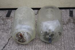 Two glass milking jars. L60cm.