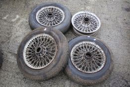 A set of four vintage MG sportscar wire wheels.
