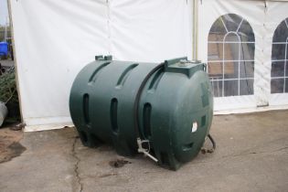 A heavy duty green plastic 'red' diesel tank. Single skin tank with refueling hose. S/n.