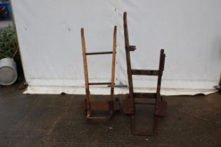 Two sets of vintage sack trucks.