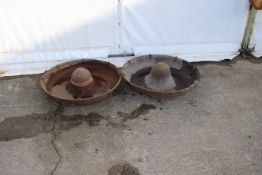 Two cast iron pig feed troughs. Both sound in base, stamped 'Capricorn and Bough'. Diameter 75cm.