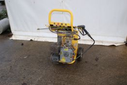 A Gardenpro power plus petrol pressure washer. In yellow, on wheels, complete with lance, H98cm.