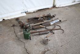 An assortment of vintage farming tools and bygones.