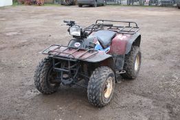 A Kawasaki Bayou quad bike. In red complete with front light, in working order.