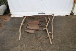 A collection of vintage grassland tools. Including scythes and hay knives etc.