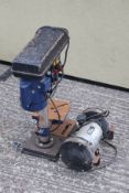 A pillar drill and bench grinder. Comprising a Power craft drill and a Wickes grinder.