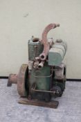 A Lister stationary engine. No. M162, in green, sold with Lister handle.