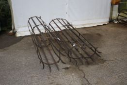 Two 19th century wrought iron tree guards. Max H163cm.