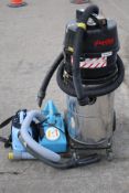 A vaccum cleaner and two hand held foggers.