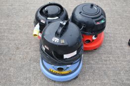 Three Numatic International 110v vacuum cleaners. Including Charles CVC 370-2 & 2x red NRV200-22.