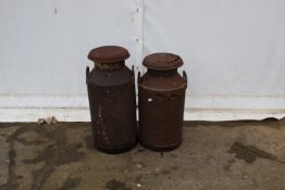 Two milk churns. Both with handles and lids, H75cm.