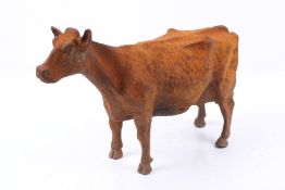 A cast iron model of a Holstein dairy cow. H24cm.