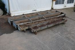 Four galvanised metal feeding troughs. In mixed condition, Max L275cm.
