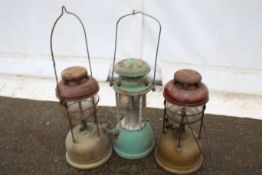 Three hurricane storm oil lanterns.