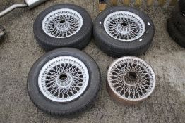A set of four vintage MG sportscar wire wheels. With three tyres: Pirelli P4000, 195/65 R 15 91H.
