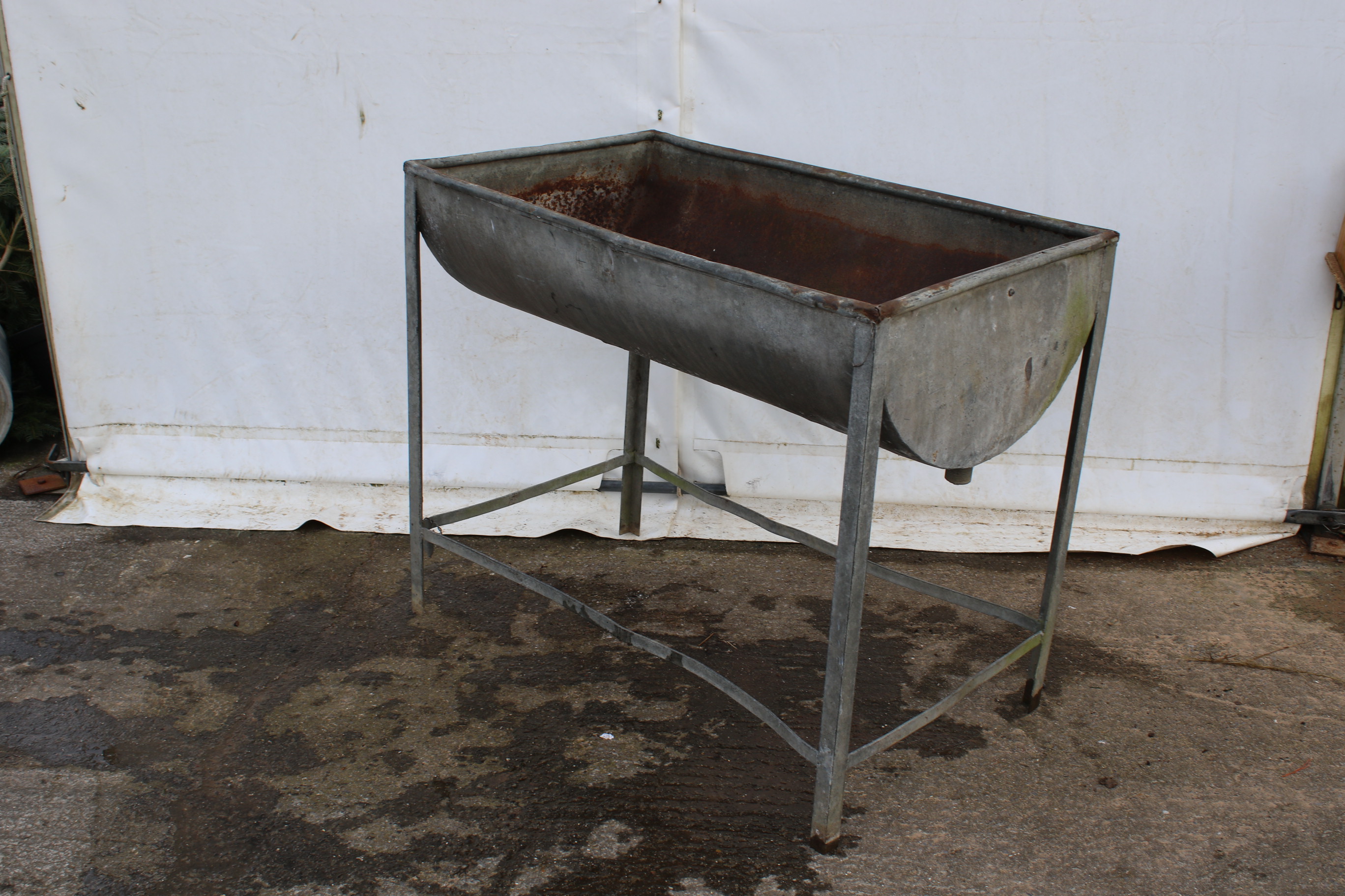 A galvanised metal wash stand and sink. H89cm x W103cm x D63cm.