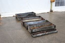 Seven galvanised metal livestock feeding troughs. Various sizes, in mixed condition, max L92cm.