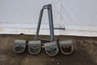 A collection of four metal autodrinkers and a swingover gate latch. All drinkers cast metal, H15cm.