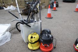 Three various industrial wet & dry vacuum cleaners plus attachments.