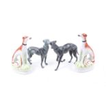 Two pairs of greyhound ornamental figures.