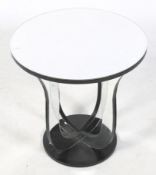 An India Jane Aston round mirror top lamp table. Of circular form with shaped supports, (RRP £595).