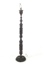 A Chinese carved hardwood standard lamp.