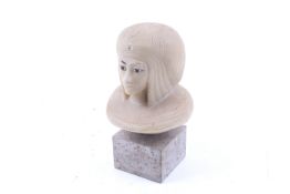 A contemporary resin bust of an Egyptian pharaoh figure.