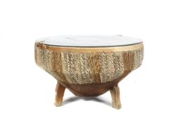 An African animal hide tribal drum coffee table.