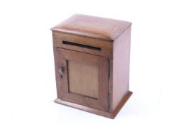 An oak internal post box.