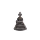 A Tibetan bronze figure of Buddha Shakyamuni.