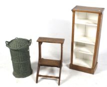 A small vintage set of folding wooden steps, a small pine book case and a green painted basket.