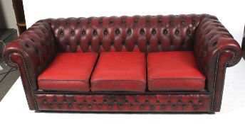 A vintage ox blood leather Chesterfield sofa.