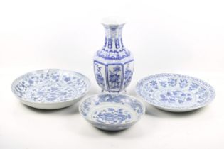 Three Chinese blue and white dishes and a vase.