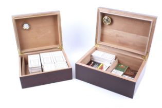 Two contemporary cigar humidors and contents.