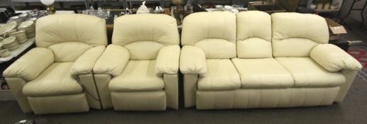 A leather suite comprising a sofa and two chairs.