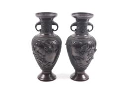 A pair of Japanese bronze vases.