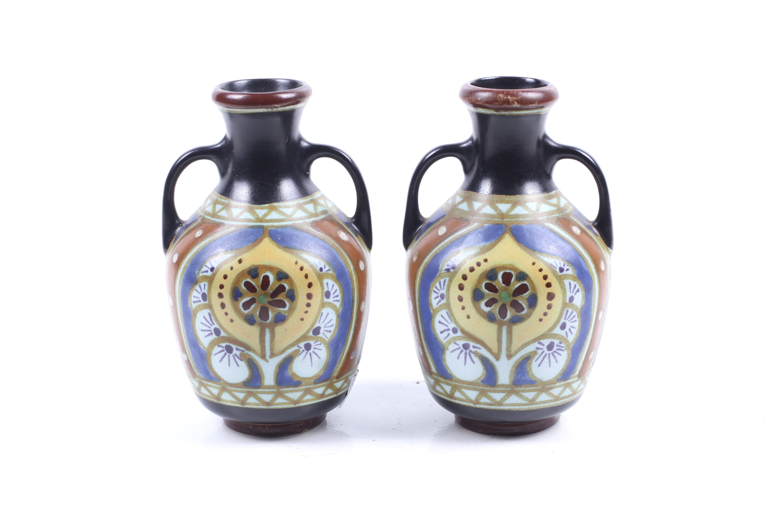 A pair of Dutch pottery Lindus Arnhem twin handled vases.