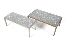 A pair of substantial metal work coffee tables.