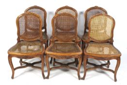 A set of six French style carved dining chairs.