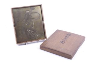 A Japanese engraved gilt copper plaque.