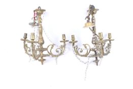 A pair of antique gilt metal ceiling lights and a wall light.