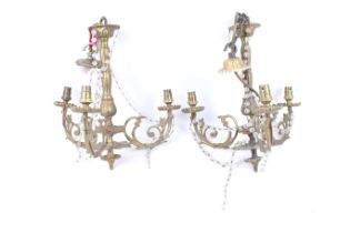 A pair of antique gilt metal ceiling lights and a wall light.